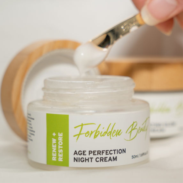 Applying Age Perfection Night cream with spatula