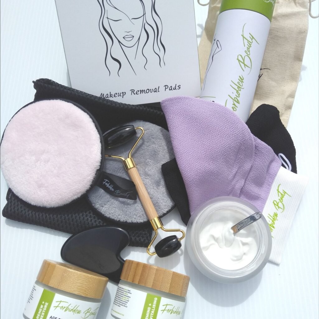 Totally Forbidden beauty set containing 3 moisturiser creams, exfoliating mitts, makeup remover pads and gua sha facial massage set.